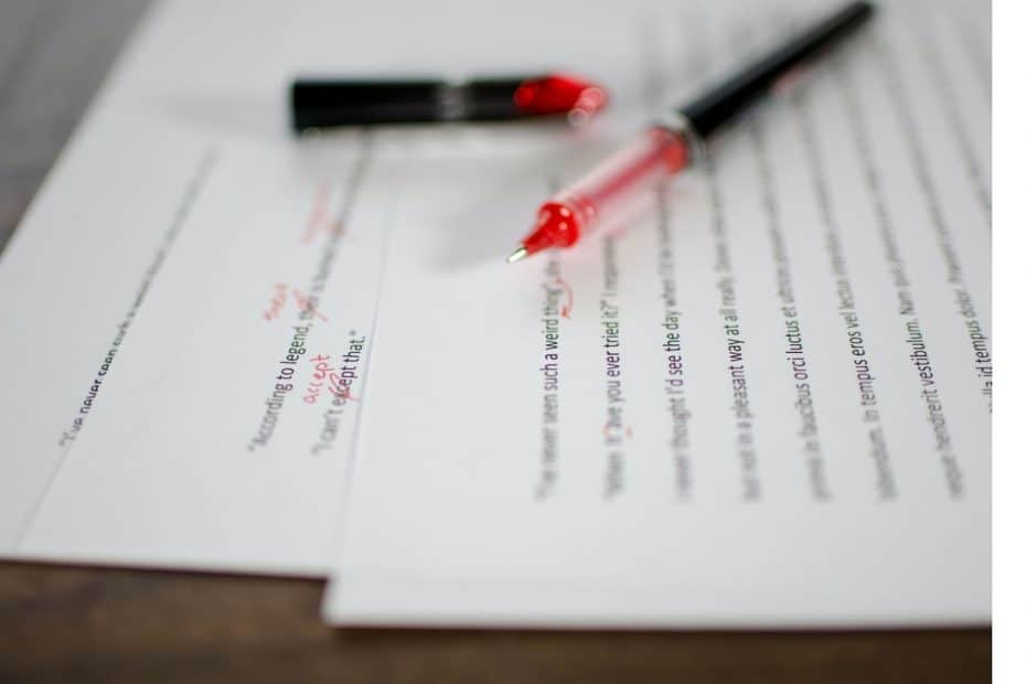 Typed papers with red pen